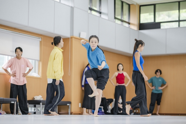 Dancers rehearse a scene from 