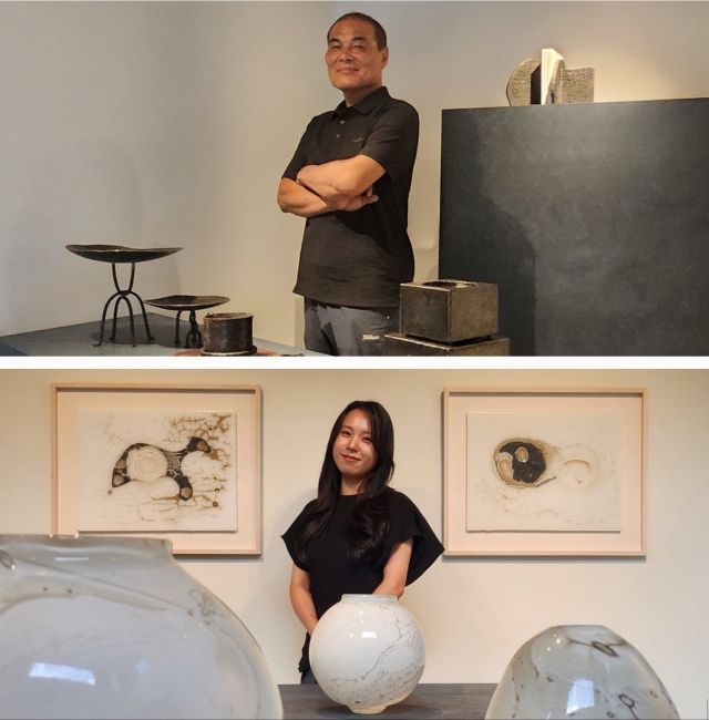 Blacksmith Jeong Hyeong-goo (above) and glass artist Park Jie-min with their creations at the Yeol Korean Heritage Preservation Society showroom (Choi Si-young/The Korea Herald)