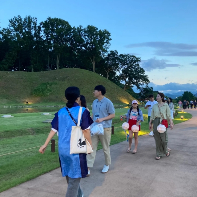 Visitors walk along the path near the Gyerim in Gyeongju, North Gyeongsang Province, in July. (Silla Culture Center)