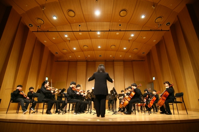 An orchestra of children of North Korean defector families performs during a concert on Jan. 28, 2023, at Solgaram Art Hall in Paju, Gyeonggi Province. (Yeeum Art Center)