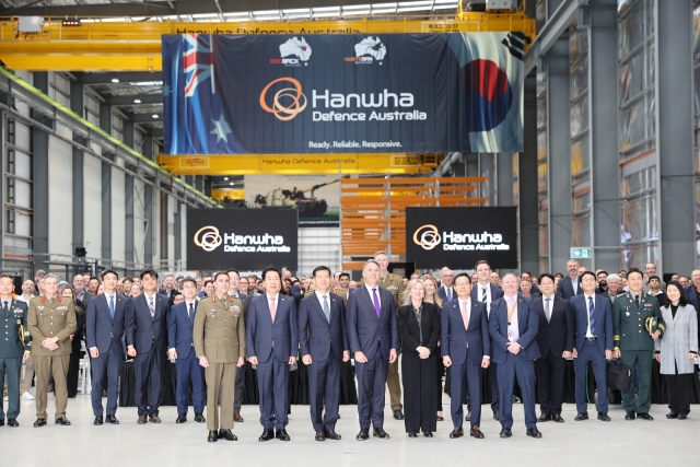 Government and military officials from South Korea and Australia as well as representatives from Hanwha Aerospace participate in the opening ceremony of the Hanwha Armored Vehicle Center of Excellence, or H-ACE, in Geelong, Australia on Friday. (Hanwha Aerospace)