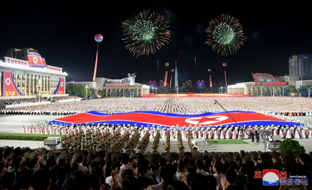 This photo, carried on Monday, shows the North holding celebrations at Kim Il Sung Plaza in Pyongyang the previous day to mark the 76th anniversary of the regime founding. (KCNA)