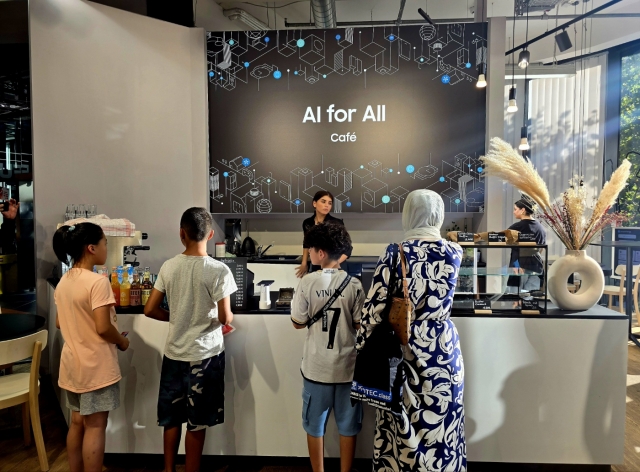 Visitors visit Samsung Electronics' AI cafe at the Saturn store in Berlin. (Jie Ye-eun/The Korea Herald)