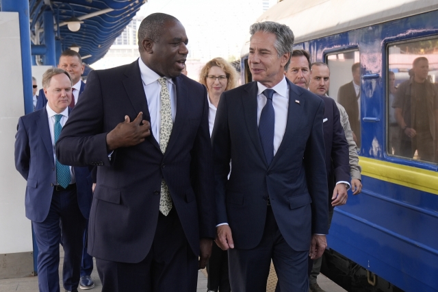 US Secretary of State Antony Blinken (right) and British Foreign Secretary David Lammy arrive at the train station in Kyiv, Ukraine, on Wednesday. (Pool Photo via AP)