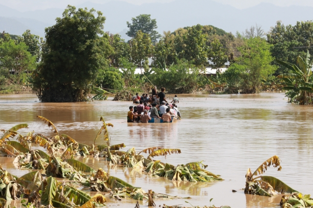 People take a boat in a flooded area in Nay Pyi Taw, Myanmar, Sept. 16, 2024. Widespread flooding in Myanmar has left at least 113 people dead and 64 missing, according to the Information Team of Myanmar's State Administration Council on Sunday. (Str/Xinhua)