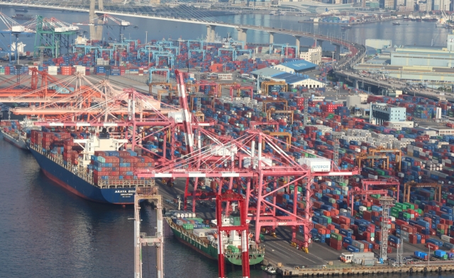 Containers are stacked at a terminal in the southeastern port city of Busan on Friday. (Yonhap)