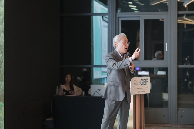 Professor Emeritus Kim Tae-yoo of Seoul National University gives a lecture on South Korea's rapidly declining birthrate at The Korea Herald's Global Business Forum, held Wednesday at The Ambassador Seoul hotel. (The Korea Herald)