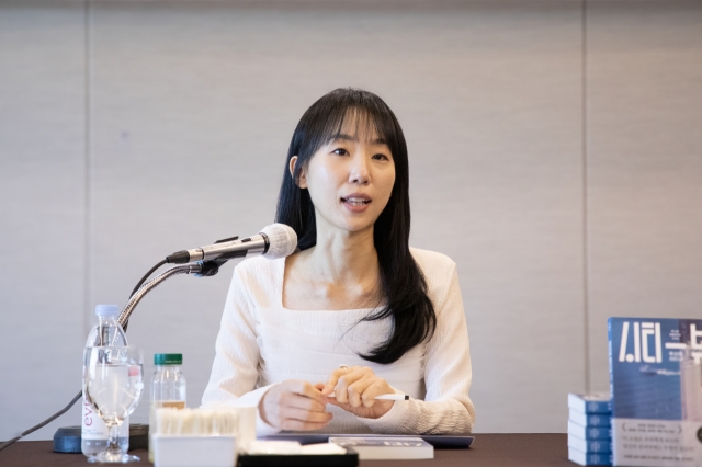 Woo Shin-young speaks at a press conference in Seoul on Tuesday. (Dasan Books)