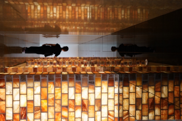 A visitor walks through the Rainbow Healing Center's relaxation zone featuring an illite-covered sauna. (Lee Si-jin/The Korea Herald)