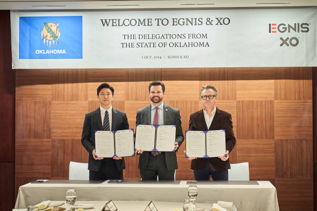 From left: Egnis CEO Park Chan-ho, Oklahoma Department of Commerce Executive Director Evan Brown and Xolution CEO Marc Von Rettberg, pose during a business signing ceremony held at The Shilla Seoul, on Tuesday. (Egnis)