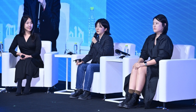 From left, visual artists Kim Ha-na, Koo Ji-min and Hong In-hye attend a special session during the Herald Design Forum 2024 held in Seoul on Tuesday. (Im Se-jun/The Korea Herald)