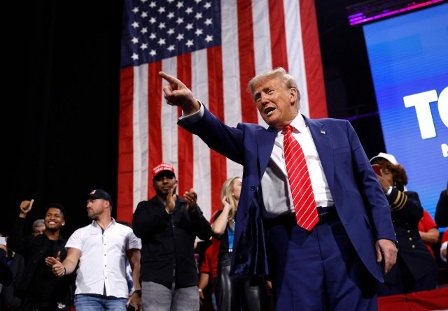 Republican presidential nominee, former US President Donald Trump points to the crowd after delivering remarks during a campaign rally at the Cobb Energy Performing Arts Centre on Tuesday in Atlanta, Georgia. (AFP)