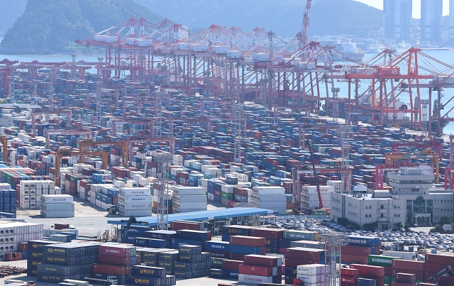 Shipping containers are stacked at a port in the southeastern city of Busan, in this file photo taken Oct. 15. (Yonhap)