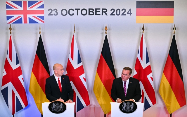 Britain's Defence Secretary John Healey (left) and Germany's Defence Minister Boris Pistorius speak during a press conference after signing the The Trinity House Agreement, the new UK-Germany Defence Agreement, at Trinity House, in London, Wednesay. (AFP)