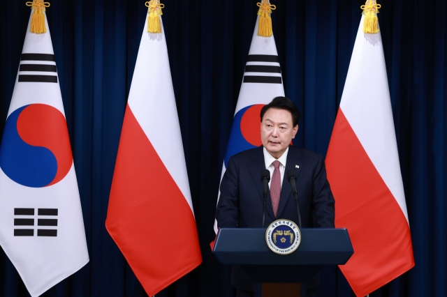 President Yoon Suk Yeol speaks during a joint press conference with Polish President Andrzej Duda at the presidential office in Seoul on Thursday. Yonhap