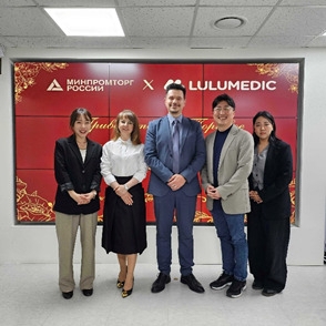 Lulumedic representatives pose for a photo with Alexey Sapetko (center). (Lulumedic)