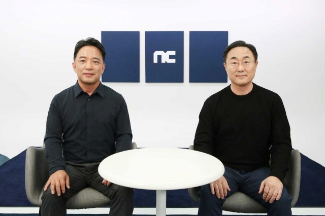 NCSoft co-CEOs Kim Taek-jin (left) and Park Byung-moo (NCSoft)