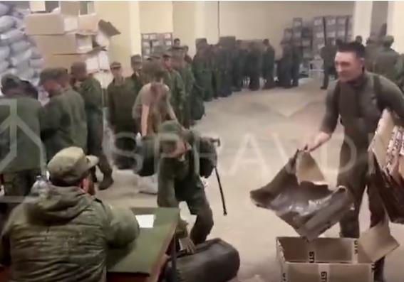 This Oct. 18, footage posted on X by the Centre for Strategic Communication and Information Security of Ukraine shows what appears to be North Korean soldiers receiving apparent Russian gear. (Yonhap)