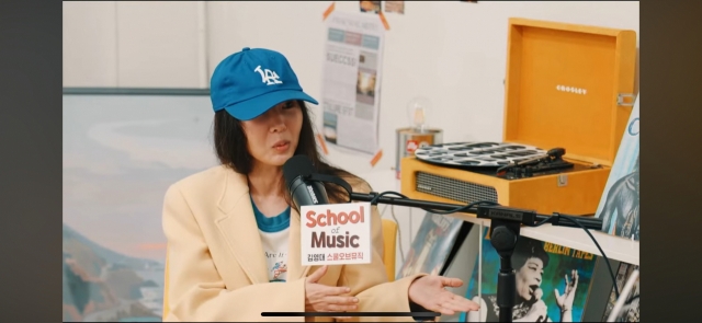 Former Ador CEO Min Hee-jin (left) speaks in a live interview with music critic Kim Young-dae on his School of Music YouTube channel, Tuesday. (YouTube)