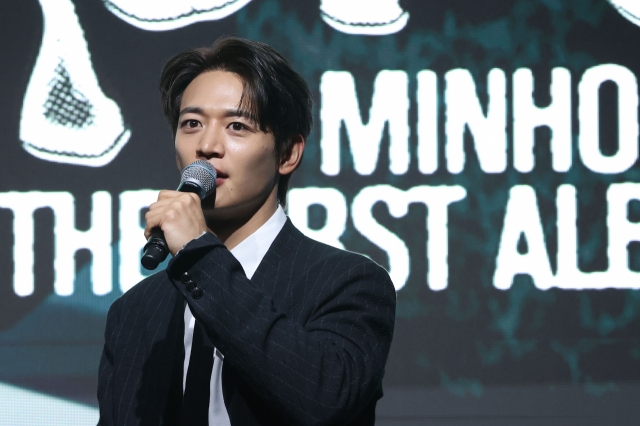 Minho speaks at a press conference for his first full-length solo album, 