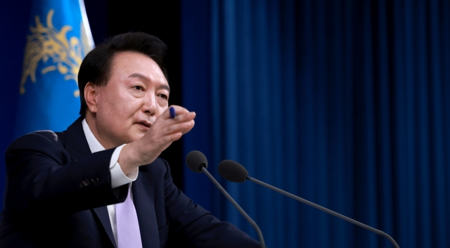 President Yoon Suk Yeol responds to press questions during a conference Thursday at the presidential office in Yongsan, Seoul. (Yonhap)