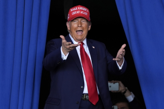 Republican presidential nominee former President Donald Trump arrives to speak during a campaign rally at Dodge County Airport in Juneau, Wisconsion on Oct. 6, 2024. (AP-Yonhap)