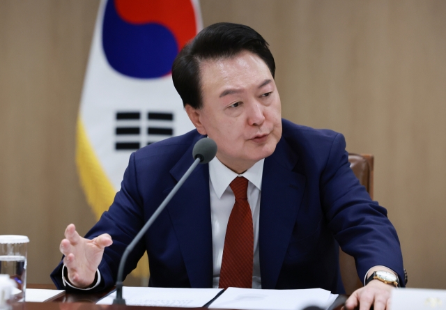 President Yoon Suk Yeol speaks during an emergency economic and security meeting of ministers and senior presidential aides at the presidential office in Yongsan, central Seoul on Sunday. (Yonhap)