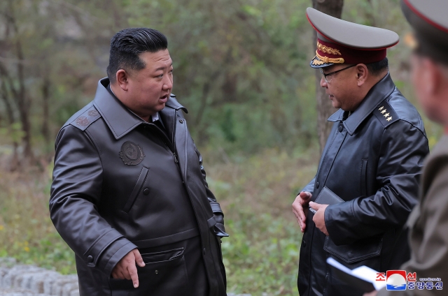 North Korean leader Kim Jong-un (left) inspects strategic missile bases, in this undated photo provided by North Korea's official Korean Central News Agency on Oct. 23, 2024. (Yonhap)