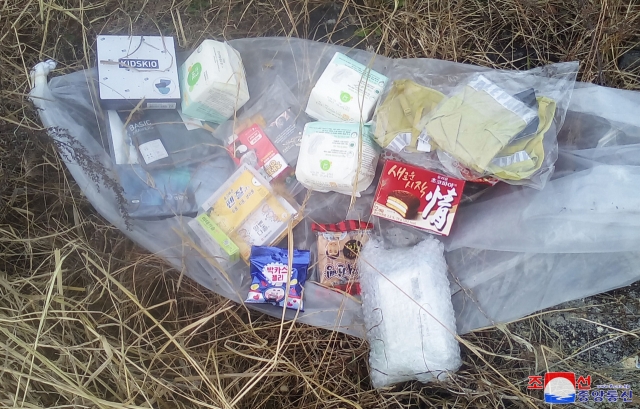 This photo released on Sunday shows a balloon containing South Korean snacks and other consumer goods. (KCNA)