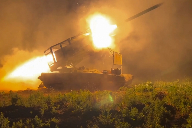 In this photo taken from a video released by Russian Defense Ministry press service on Nov. 13, the Russian army's multiple rocket launcher Solntsepyok fires towards Ukrainian positions in the border area of Kursk region, Russia. (Russian Defense Ministry Press Service via AP)