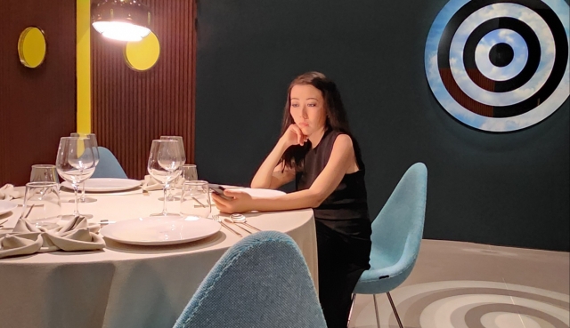 A dummy looking at a cellphone at a restaurant in one of spaces at the exhibition “Elmgreen & Dragset: Spaces.” (Choi Si-young/The Korea Herald)