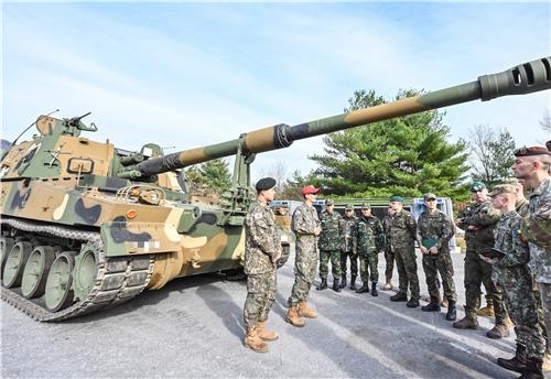 Foreign troops take part in a training program involving the K9 self-propelled howitzer. (The Army)