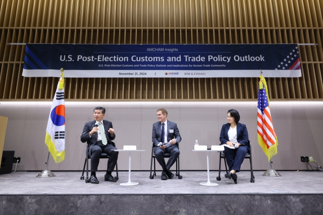 AmCham Chairman and CEO James Kim (left) speaks during a panel discussion with John Leonard (center), advisor at Kim & Chang, and Yoo Myung-hee, former South Korean chief trade negotiator, in Seoul on Friday. (AmCham)