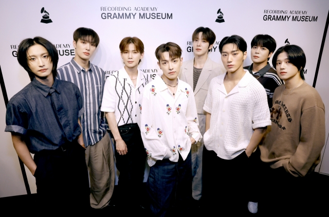 Seonghwa Park (from left), Mingi Song, Yeosang Kang, Hongjoong Kim, Yunho Jeong, San Choi, Jongho Choi, and Wooyoung Jung attend A Conversation with ATEEZ at GRAMMY Museum LA Live on July 22, in Los Angeles, California. (Getty Images)