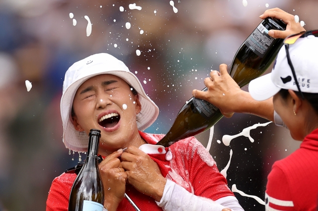 Amy Yang of South Korea is doused with champagne after winning the KPMG Women's PGA Championship at Sahalee Country Club in Sammamish, Washington on June 23. (Getty Images)