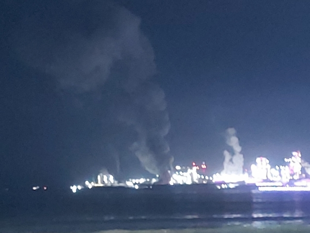 This photo, provided by a member of the public, shows black smoke rising from a Posco factory in Pohang, North Gyeongsang Province, Sunday. (Yonhap)