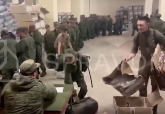 This Oct. 19, footage posted on X, formerly Twitter shows what appears to be North Korean soldiers receiving gear from Russian soldiers. (Centre for Strategic Communication and Information Security of Ukraine)