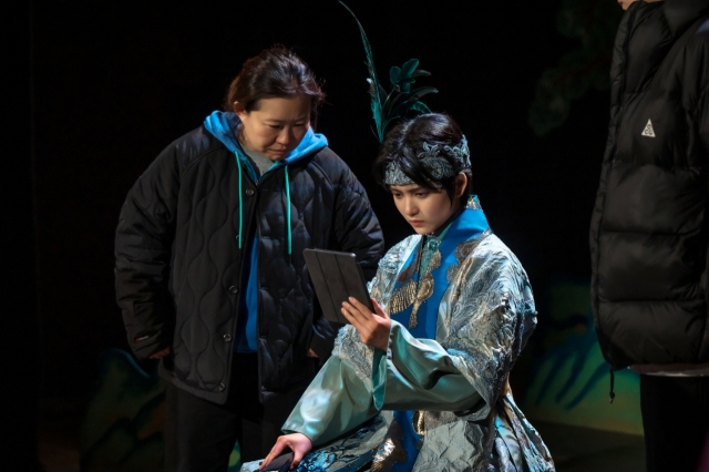 Director Jung Ji-in (left) is seen on the set of 