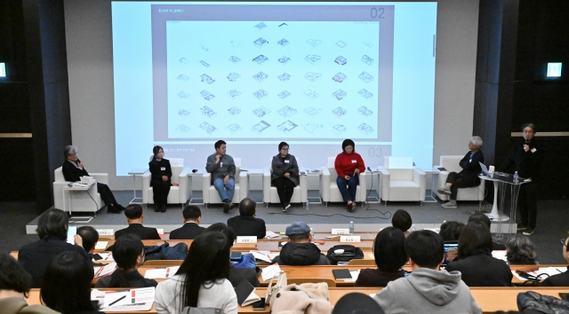 Park Chang-hyun (first from right), CEO of A Round architects, gives a presentation on shared dwelling in Third Place 6 in Seoul, during the second roundtable of 