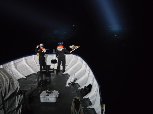 This photo provided on Monday shows a search and rescue operation for a missing leisure boat in the East Sea. (Uljin Coast Guard)