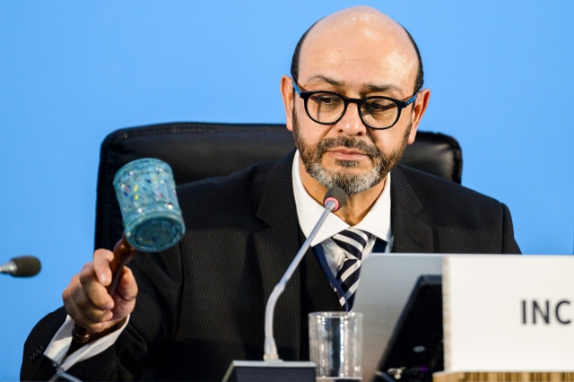 INC-5 Chair Luis Vayas Valdivieso brings down a gavel, made with recycled plastic bottle caps, to mark an agreement that talks of the international treaty to curb plastic pollution will resume at a later date, during an open plenary session of the INC-5 at Bexco in Busan, early Monday. (AFP-Yonhap)