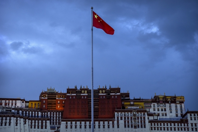 The Chinese flag flies at a plaza near the Potala Palace in Lhasa in western China's Tibet Autonomous Region, June 1, 2021, as seen during a government organized visit for foreign journalists. (File Photo - AP)