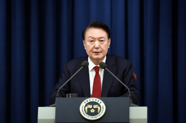 President Yoon Suk Yeol delivers an address to the nation in his office on Tuesday. (Presidential office)