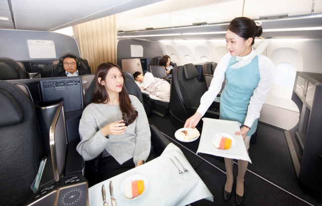 A Korean Air flight attendant shows the airline's onboard service. (Korean Air)