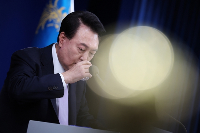 South Korean President Yoon Suk Yeol takes a sip of water as he attends a press conference on state affairs at the presidential office on November 07, 2024 in Seoul, South Korea. Getty Images