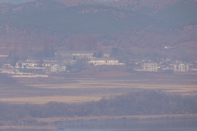 The North Korean border county of Kaepung in North Hwanghae Province remains as quiet as usual, as seen from the Odusan Unification Observatory in Paju, Gyeonggi Province, on Wednesday, following the declaration and subsequent lifting of martial law. (Yonhap)