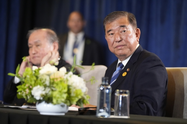 Prime Minister of Japan Shigeru Ishiba sits during a trilateral meeting with President Joe Biden and the President of South Korea Yoon Suk Yeol in Lima, Peru on Nov. 15, 2024. (AP)