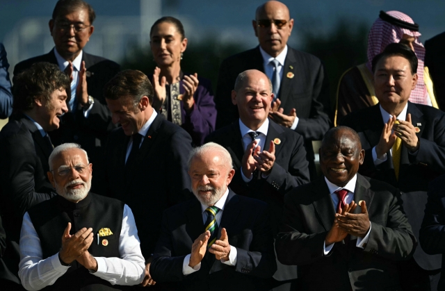 South Korea's President Yoon Suk Yeol pose for a group photo after the first session of the G20 Leaders' Meeting in Rio de Janeiro, Brazil, on November 18, 2024. (AFP)