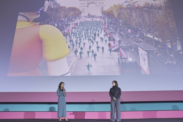 Marianne Lee, chief marketing officer of Netflix (left) and Kim Min-young, vice president of content for Asia (ex-India) at Netflix, talk during a press conference held in Jung-gu, Seoul, Monday. (Netflix)