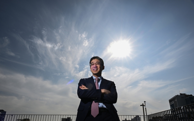 Solutions for Our Climate head Kim Joo-jin poses for a photograph on the rooftop of the Heyground building in Seoul, where his NGO is located. (Park Hae-mook/The Korea Herald)